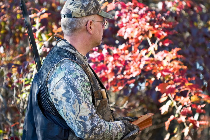 Turkey hunter working a turkey box call